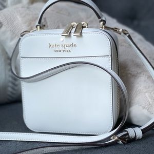 White Authentic Kate Spade crossbody bag with dust bag.